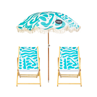 Beach umbrella and two wooden chairs with blue and white pattern on a white background, featuring the brand 'Splash & Ray'.